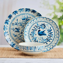 Blue ceramic dinner bowl with white base and ornate bird and floral pattern