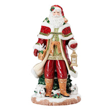 Red Santa figurine standing with lantern and bag, ornate coat and boots