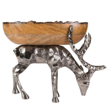 Wood centerpiece bowl on hammered-metal reindeer pedestal, side view of curved antlers
