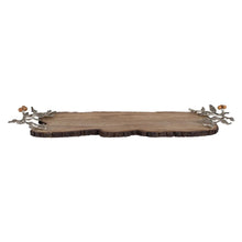 Wood serving board with scalloped bark edge and metal leaf and berry clusters
