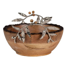 Wooden serving bowl with silver leaf design and acorn-style topper