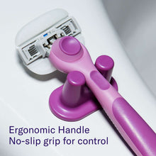 Razor handle with no-slip grip and exposed blue blade cartridge