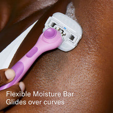 Razor gliding over skin with a pink moisture bar