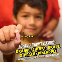 Chewable vitamin tablet held between fingers with flavor callouts for kids