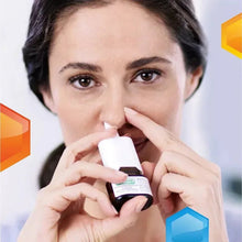 Flonase nasal spray being held near a person’s nose