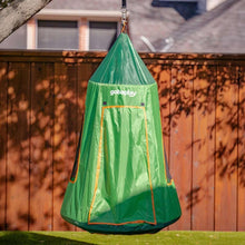 Green tented saucer swing with open front panel and orange-trim accents outdoors.