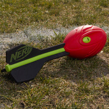 Red foam vortex football with green oval insert and black fin with lime green stripe