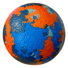 Foam dodgeball with orange, blue, and teal world-map pattern and textured surface