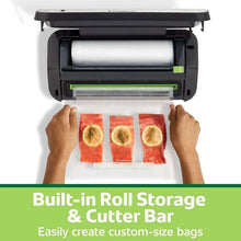 Vacuum sealer countertop unit open with vacuum chamber and roll storage compartment
