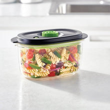 FoodSaver vacuum sealer lid on marinate container with preserved food