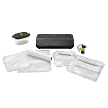 FoodSaver vacuum sealer appliance with vacuum bags, marinate container, and small accessories