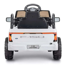 Rear view of white Ford ride-on truck with orange taillights and black steering wheel