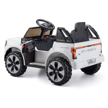 Side view of white Ford ride-on truck with black seat and orange rear trim