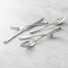 Fortessa Ellsie 20-piece flatware set with polished stainless forks and spoons, angled