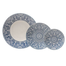Blue decorative dinner plates with ornate floral medallion and scalloped border