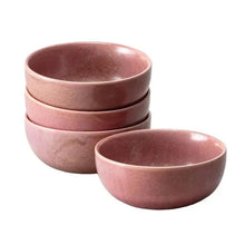 Stacked rose pink serving bowls and cereal bowls, textured ceramic with glossy glaze