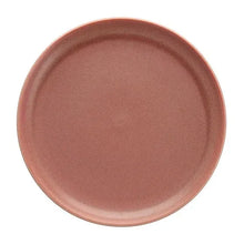 Rose-pink dinner plate with smooth center and textured speckled glaze