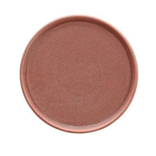 Round rose pink dinner plate with raised rim, textured ceramic speckle surface