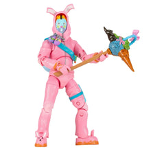 Pink armored action figure with blue visor holding a blue and brown tool