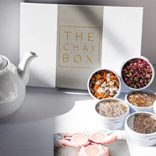 Chai sampler set with gift box and several small cups of loose leaf tea blends