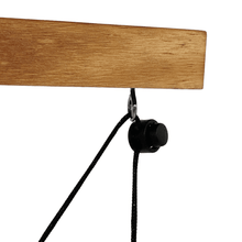 Wood beam with black hanging rope and ring hook attachment