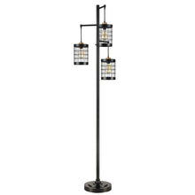 Black metal floor lamp with three stacked caged glass shades and tall base