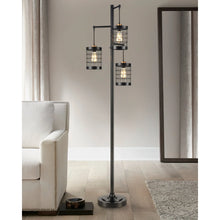 Franklin floor lamp with three black caged glass shades on a tall round base
