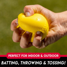 Yellow foam baseball held in a hand with a soft, textured surface