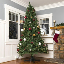 Artificial Christmas tree on dark green 360-degree rotating stand base with four arms