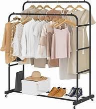Freestanding double-rod garment rack in black with rolling wheels and lower shelf