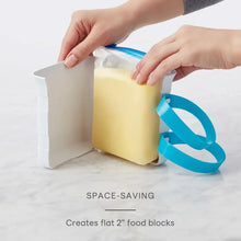 Freezer food block maker mold with blue band holding a flat food block from a bag
