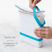 Freezer food block maker mold with blue silicone band being filled by a bag