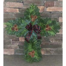 Pine cross wreath with red and green plaid ribbon and pinecone ornaments