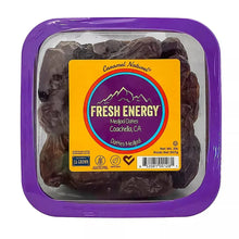 Medjool dates tub with dark, wrinkled dates in a clear plastic tray