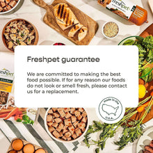Freshpet guarantee card over dog food roll pieces in a bowl