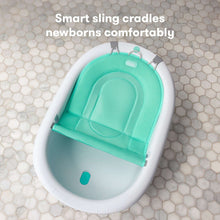 White baby tub sling cradle with teal mesh newborn support