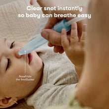 NoseFrida Snot Sucker with blue tube near a baby's nose