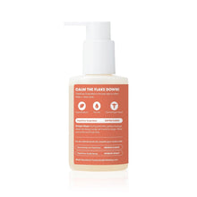 Cradle cap treatment bottle with white pump and orange back label, centered