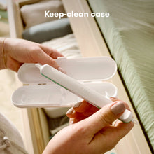 Baby grooming picker held with matching white storage case, teal detail on handle