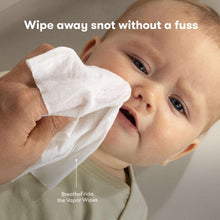 Baby being wiped with BreatheFrida Vapor Wipes on cheek
