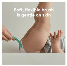 Turquoise blue silicone booty brush applicator applying cream to infant skin