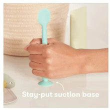 Turquoise silicone booty brush applicator with stay-put suction base