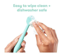 Turquoise blue silicone booty brush applicator being wiped clean