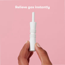 White windi tube held in hands for instant infant gas relief