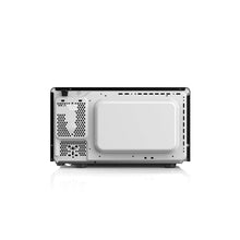 Open microwave oven cavity with white interior and vent panel, front access