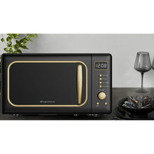 Frigidaire retro countertop microwave oven with gold-trimmed door and control panel