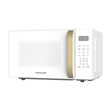 Frigidaire microwave oven with white door, gold handle, and digital clock display
