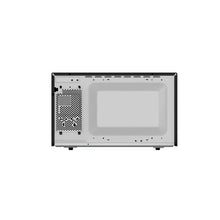 Countertop microwave oven interior view with vented grille and white cooking cavity