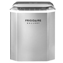 Stainless steel ice maker front with black top opening and control panel