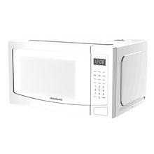 Frigidaire microwave, white front panel with keypad and clock display